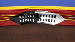 Eswatini National Flag, Flag folded in half and placed on wood desk