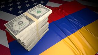 Armenia National Flag, American dollars and flag placed on top of the American flag