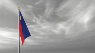 Liechtenstein National Flag, The national flag and flagpole visible from afar against a black and white sky background